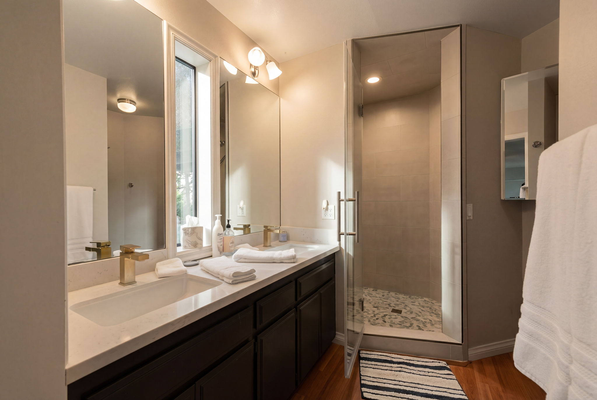 Updated bathroom with dual vanity and walk-in shower