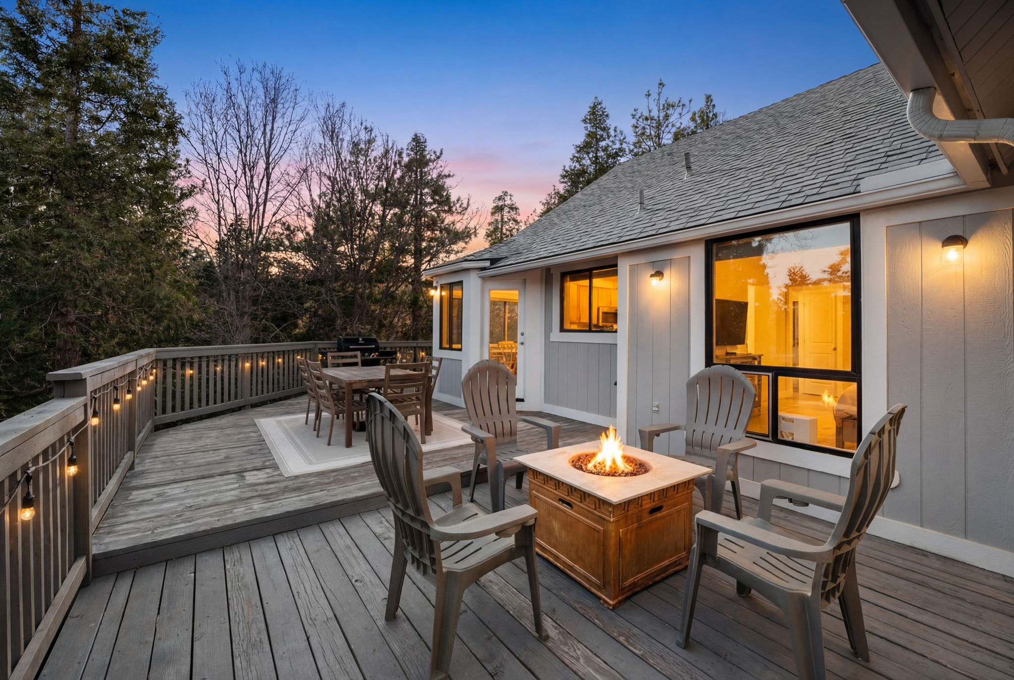 Outdoor deck and fire table at sunset